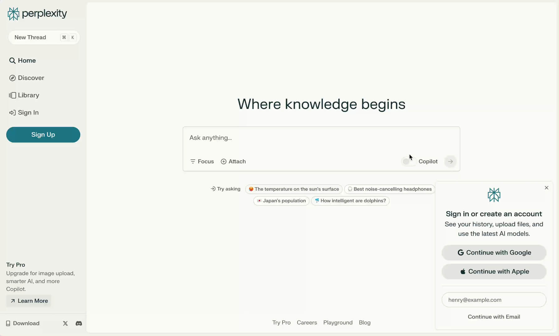 Screenshot of the Perplexity AI homepage showing the search bar, Copilot toggle, and prompt suggestions like “How intelligent are dolphins?” and “Japan’s population.”