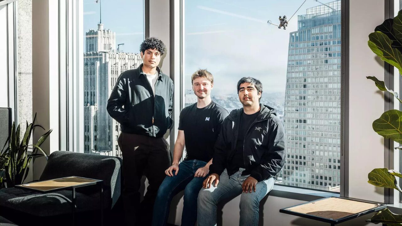 Mercor Founders at the Crossroads of AI and Talent – Tumisang Bogwasi Brendan Foody, Adarsh Hiremath, and Surya Midha, co‑founders of Mercor, standing together inside a modern office with large windows overlooking a city skyline.