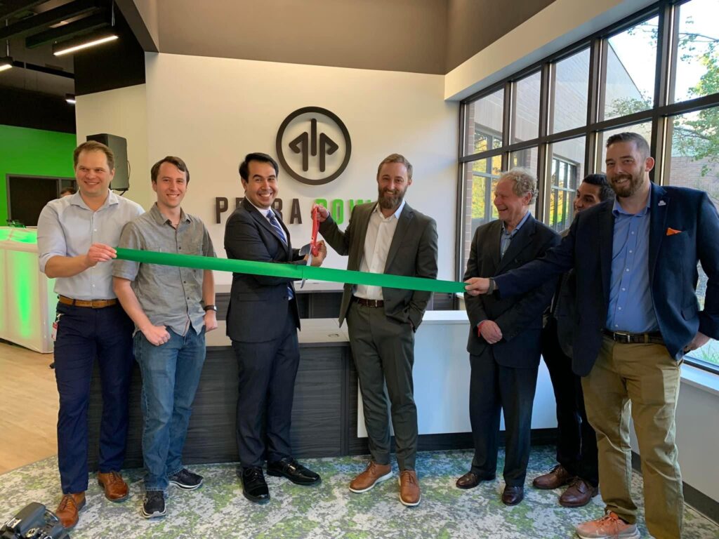 Petra Power Opens New Headquarters with Founders Partners and Local Leaders – Tumisang Bogwasi Petra Power co-founders, Partners, and Local Leaders cutting a green ribbon at their new headquarters, joined by local leaders and partners.